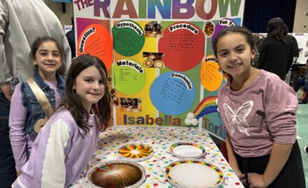 South Row third graders Isabella Arena, Ava Mae Gauvin and Victoria Thornton with their science fair project titled "Be The Rainbow."