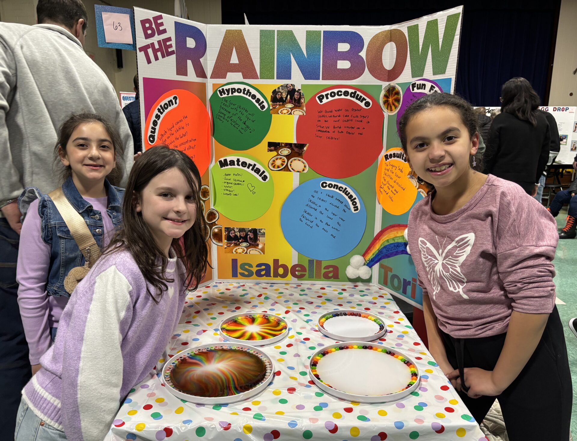 IMG_3160 South Row third graders Isabella Arena, Ava Mae Gauvin and Victoria Thornton with their science fair project titled "Be The Rainbow."