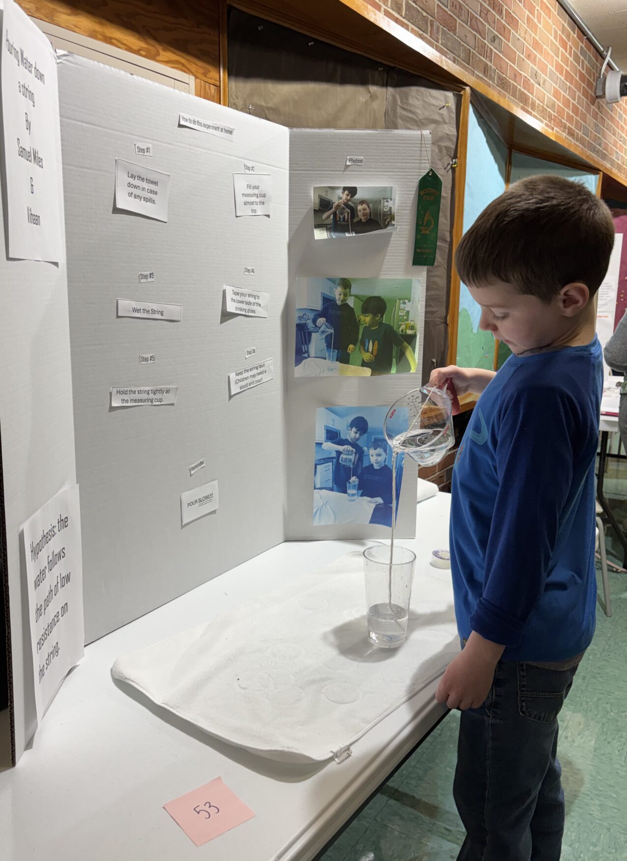 IMG_3172 South Row Elementary School second grader Samuel Miles created a science project testing the ability to pour water down a string.